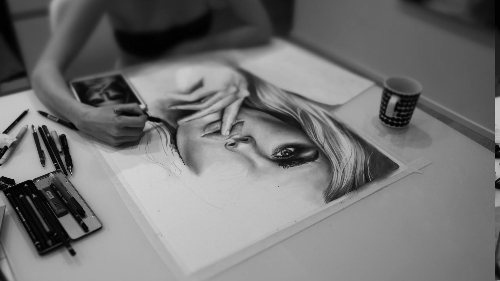 A painting in progress on the easel in the studio